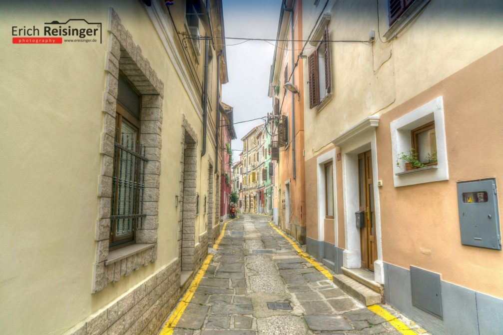 A narrow street in the old part of the town of Izola, Slovenia