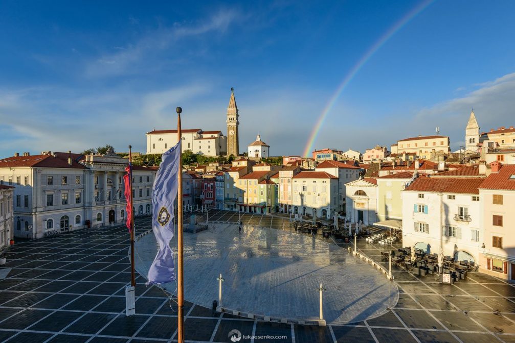 Elevated view of Tartini Square In Piran, Slovenia with a rainbow across it