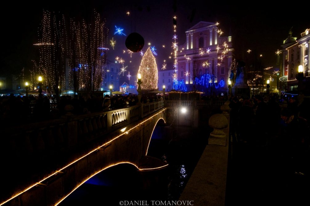 View from the Triple Bridge towards the Preseren square at night during the festive season