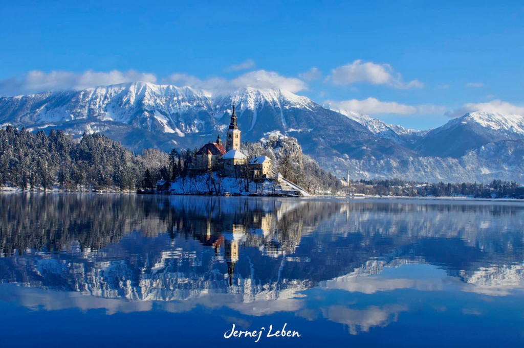 Bled Island in the middle of Lake Bled covered in snow in winter