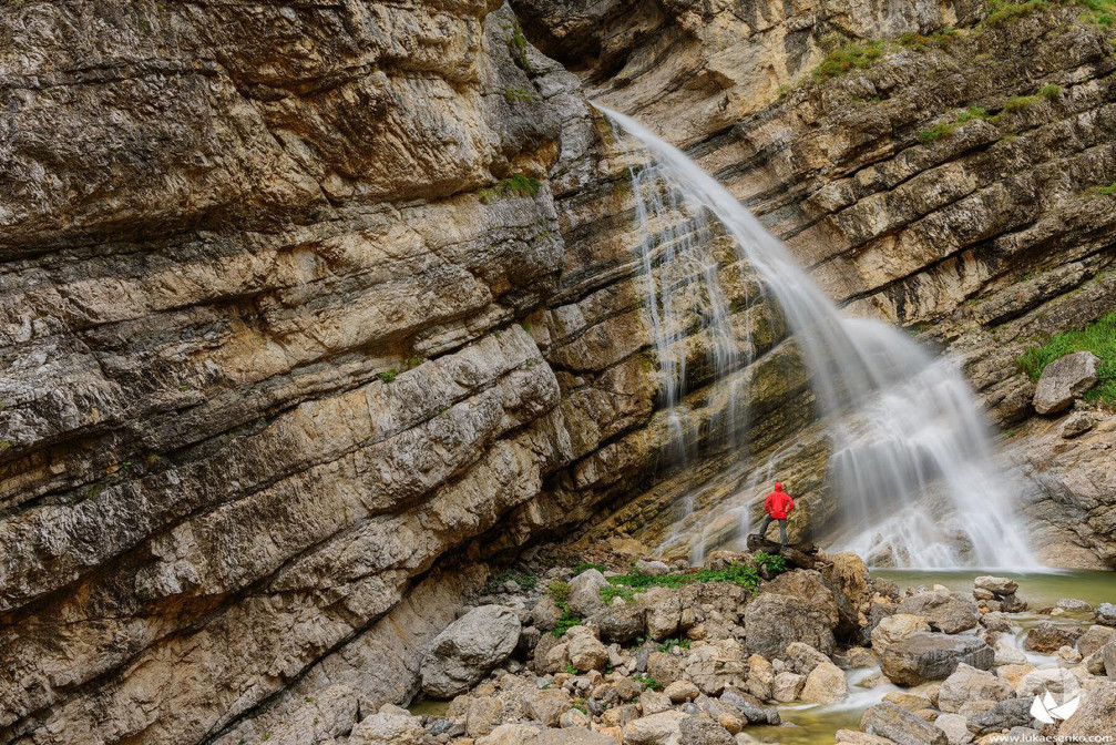 Very unique leaning Predelica waterfall with a 20 meters drop in Triglav National Park, Slovenia