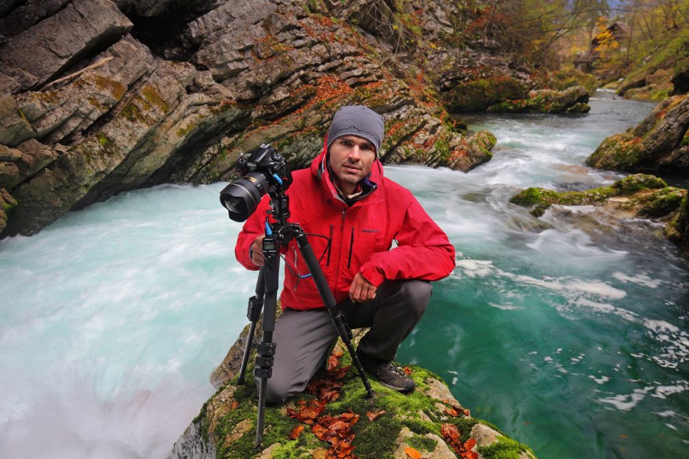 Slovenian landscape photographer Luka Esenko posing with his camera