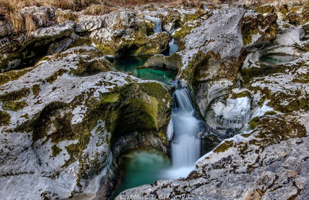 A small waterfall created by the Mostnica mountain stream in the Voje valley, Slovenia