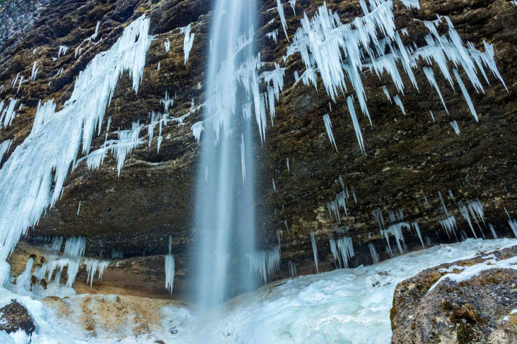 Frozen Pericnik waterfall and beautiful formation of icicles in winter time, Slovenia