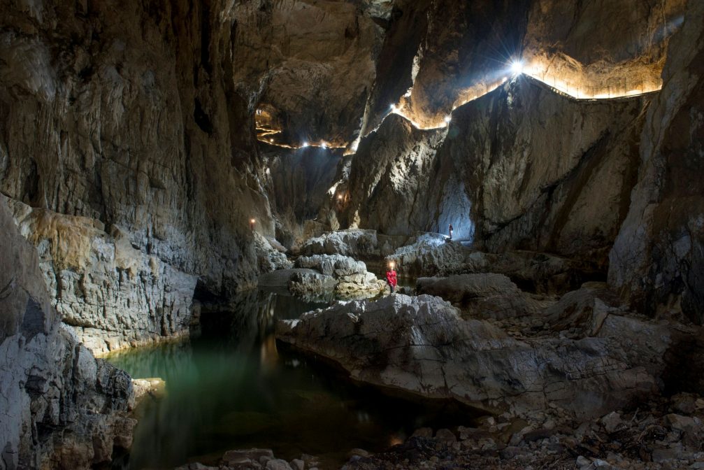 Lighted pathways mark the path alongside the Reka River through Skocjan Caves