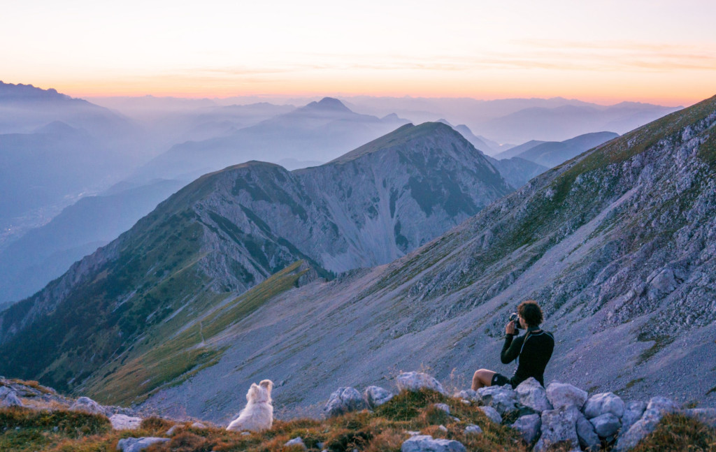 The Slovenian landscape photographer Ales Krivec at work, focusing on a sunset in the Alps