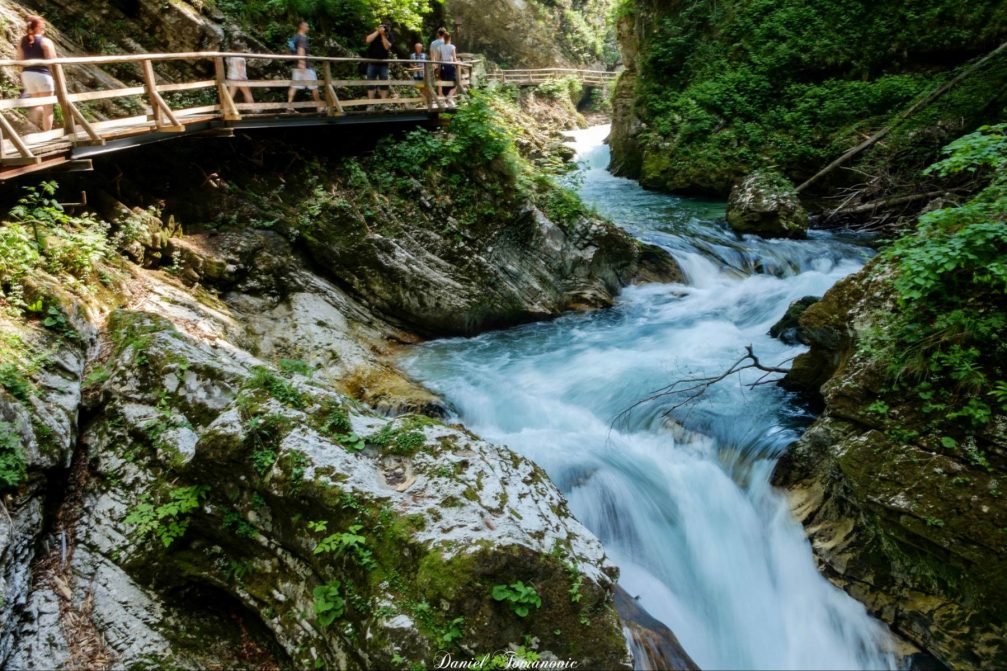 Vintgar Gorge and a group of tourists on a 1600-metre-long wooden walkway