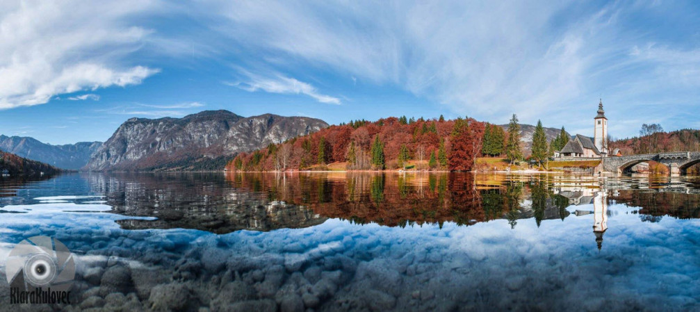 Lake Bohinj, Slovenia in autumn with the Church of St. John the Baptist in the background