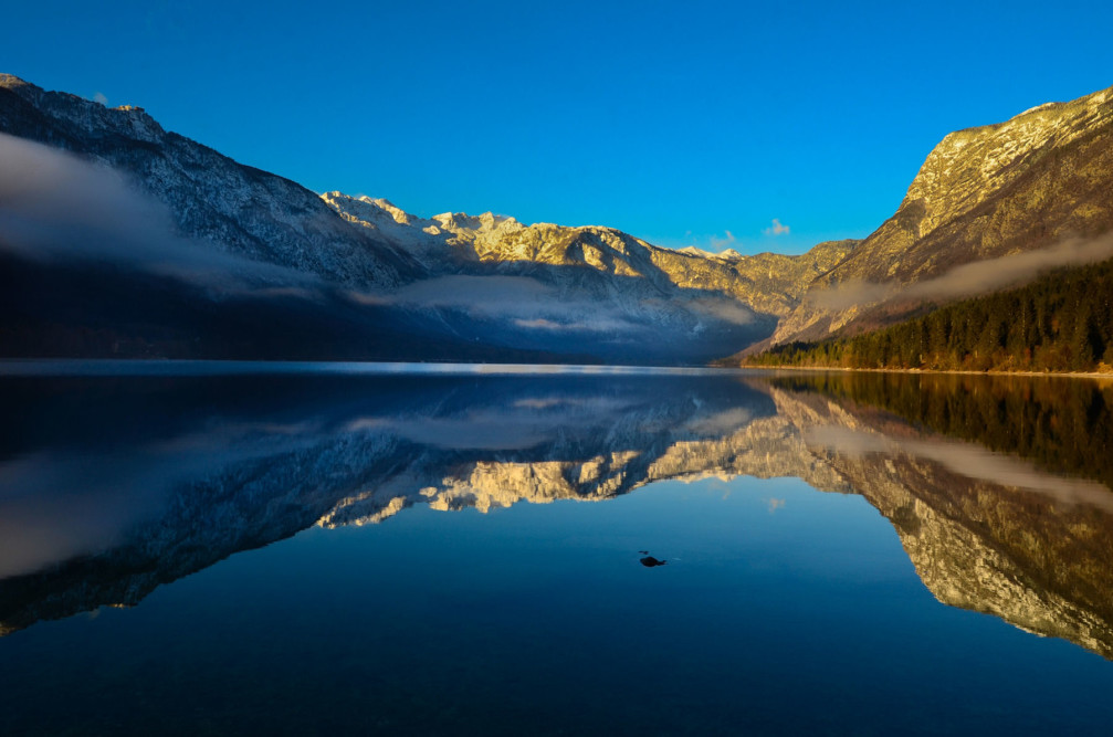 Lake Bohinj, Slovenia is famous for the still water and perfect reflection