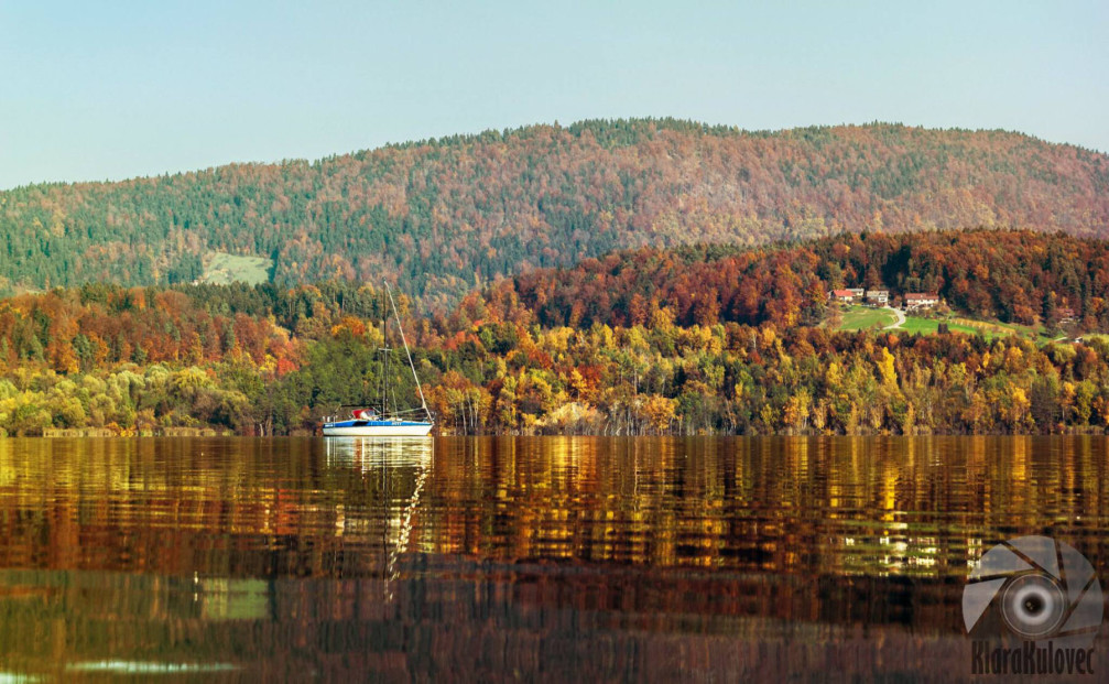 Sailboat in Lake Velenje, Slovenia in autumn