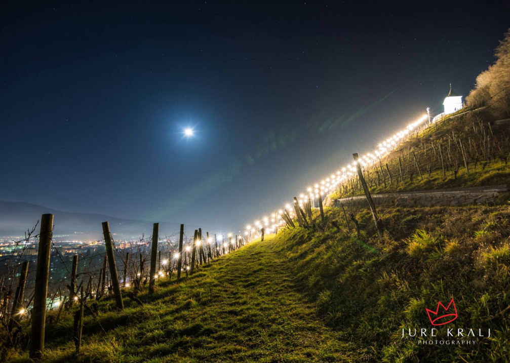 Pyramid Hill vineyards above the city of Maribor, Slovenia lit up with Christmas lights