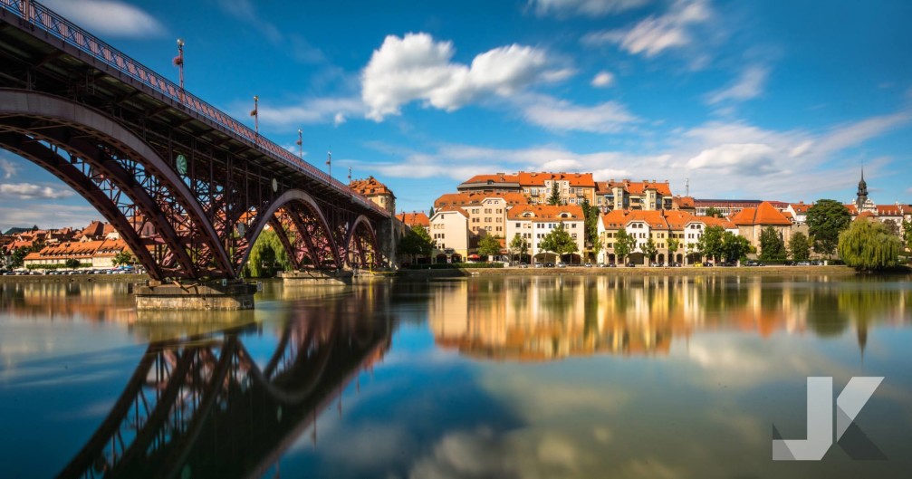 Lent and Old Bridge across the Drava river on sunny summer day, Maribor, Slovenia