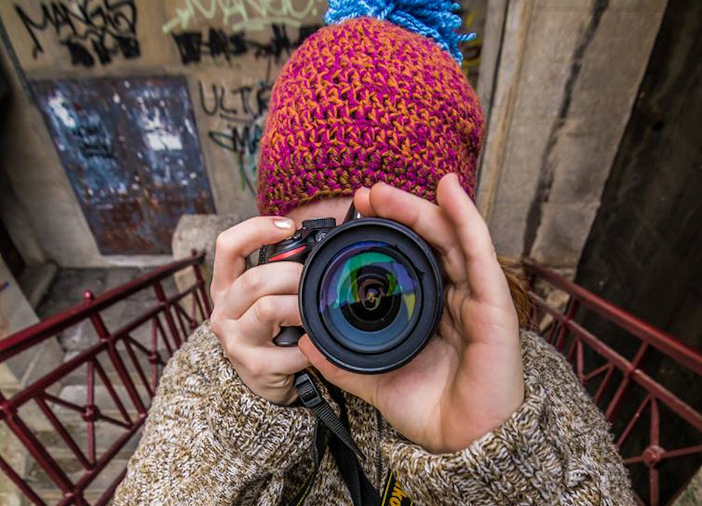 Slovenian photographer Klara Kulovec with her camera in her hands