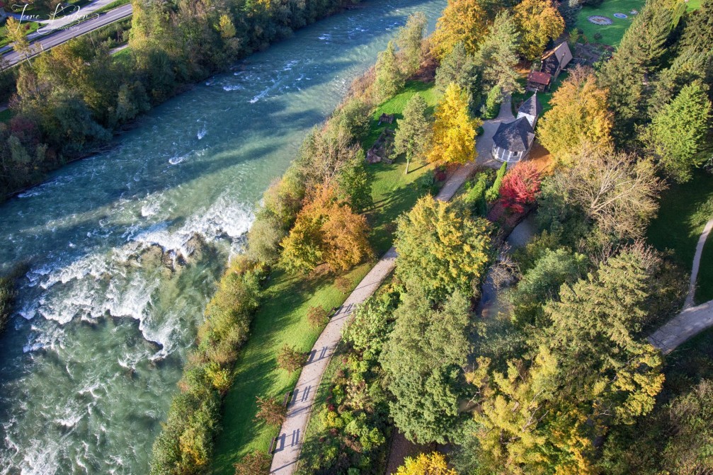 Aerial view of the Savinja river flowing through the beautiful Mozirski Gaj flower park, Slovenia