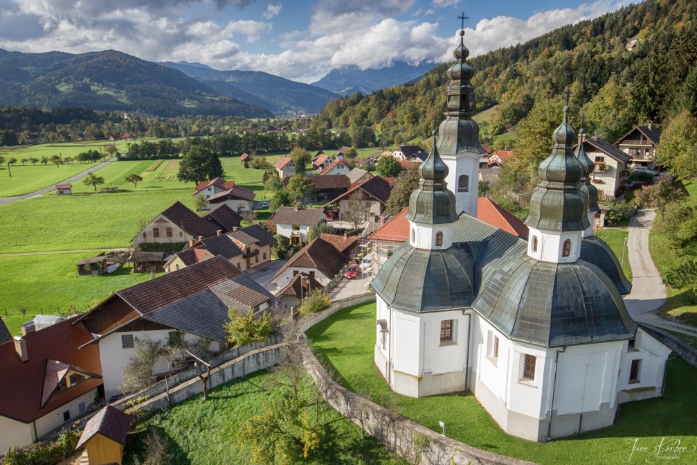 Aerial view of the village of Okonina, Slovenia with its church of St. James