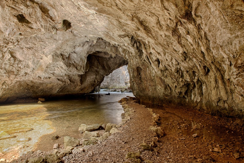 The Rak river springs from the Zelske Jame caves at Rakov Skocjan valley in Slovenia