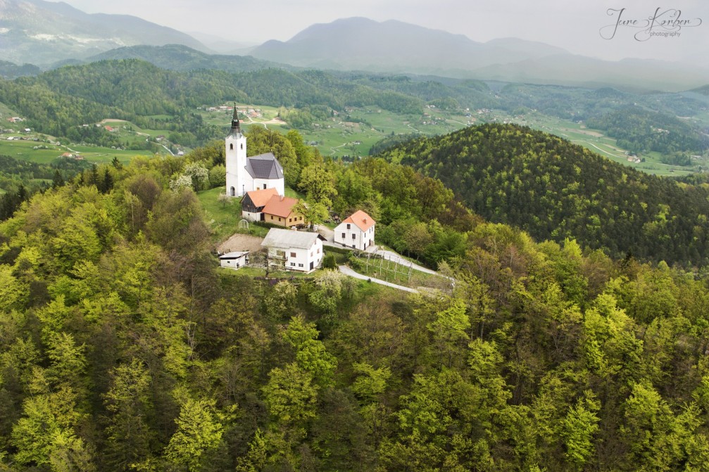 Aerial view of the village of Sentjungert, Slovenia with its Church of St. Cunigunde