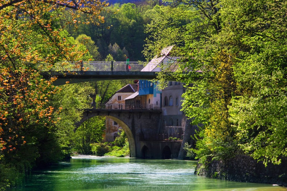 Six hundred year old stone Capuchin Bridge across the Selska Sora in Skofja Loka, Slovenia