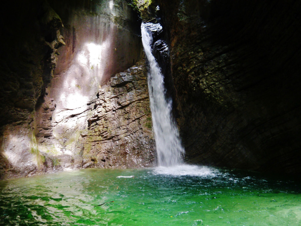 Emerald green colour of the water in the pool at the base of the Kozjak waterfall