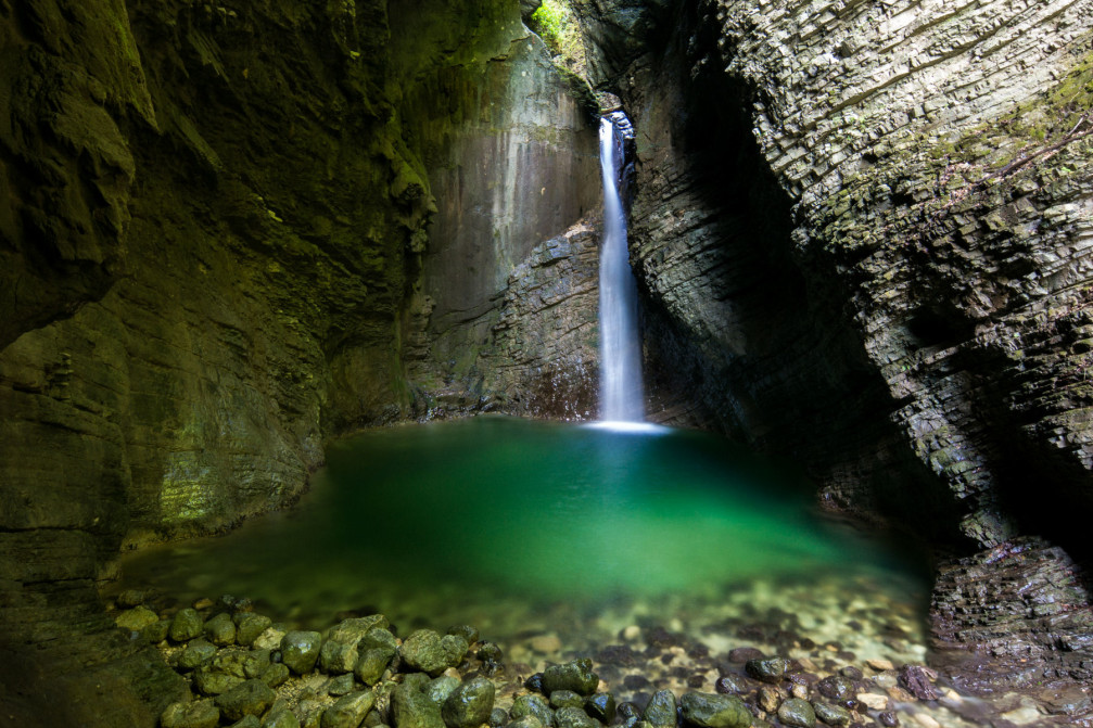 Waterfall Kozjak with the beautiful emerald green pool at its base