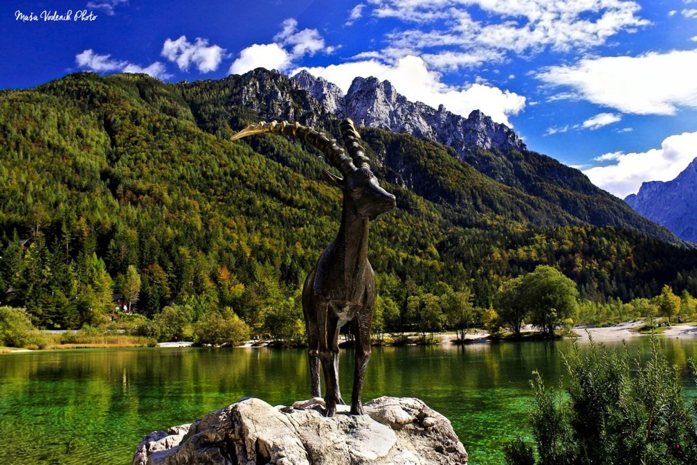 The statue of Goldhorn standing proudly at the shore of Lake Jasna near Kranjska Gora, Slovenia