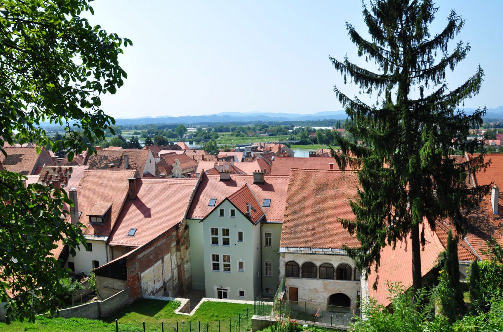 A view over historic old houses with red-tiled roofs from Ptuj castle