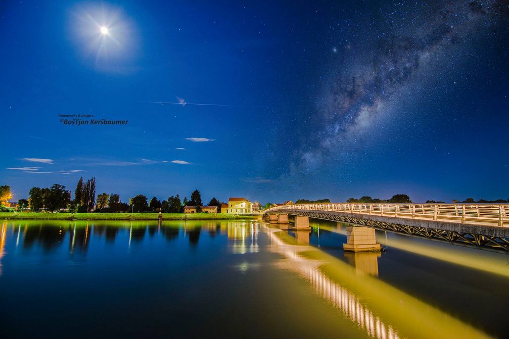 Milky Way over the footbridge in Ptuj, Slovenia at night