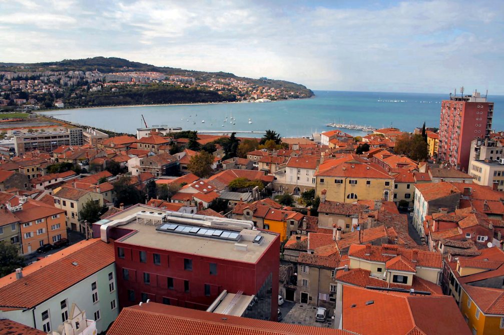 An elevated view over the town of Koper and the Adriatic Sea from the bell tower