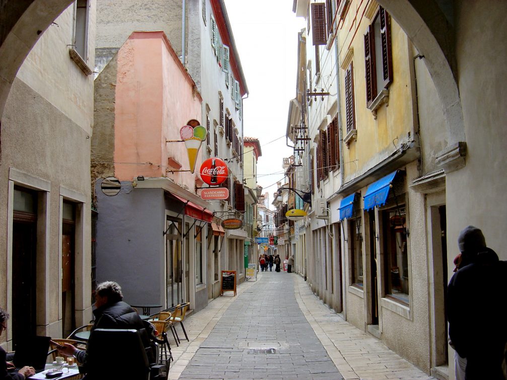 A narrow street and picturesque old houses in the old part of Koper