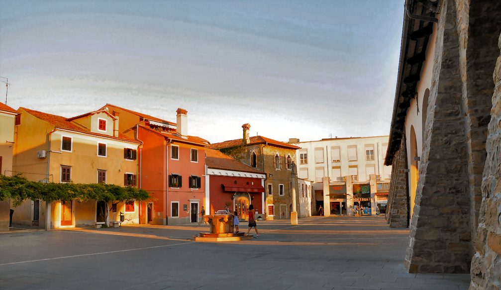 The Carpaccio square in Koper with the Column of St. Justine and the capital shaped well