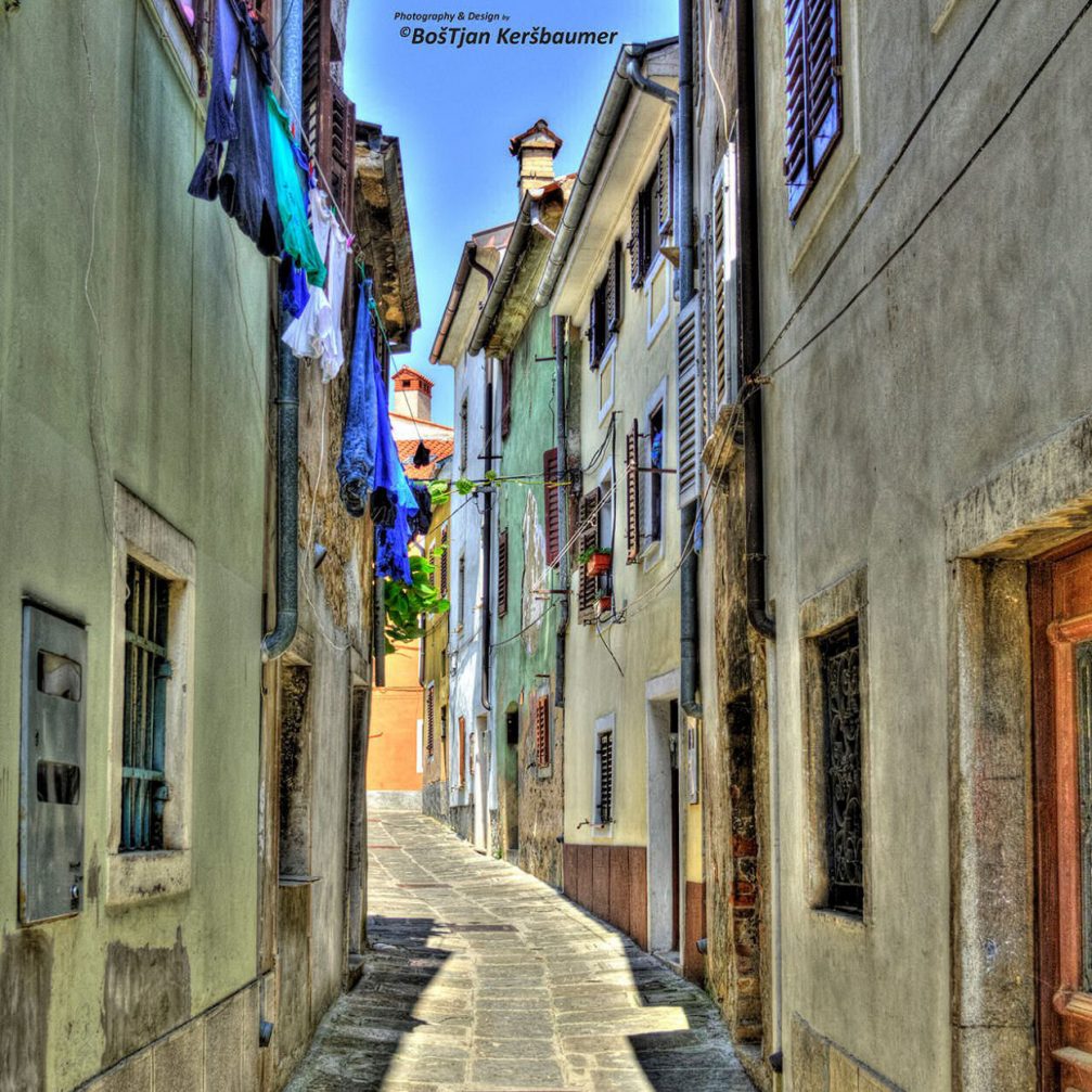 A narrow winding street in the romantic old fishing town of Izola, Slovenia