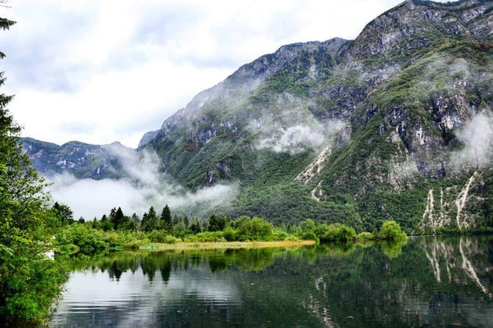Lake Bohinj in the Triglav National Park is surrounded by the majestic mountains of the Julian Alps