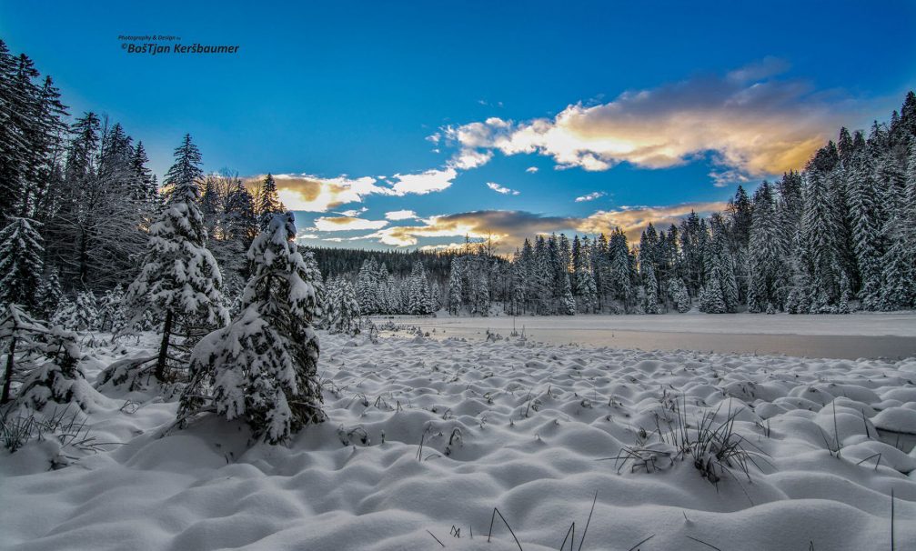 The Jezerc reservoir in the Pohorje Mountains decked in snow in winter