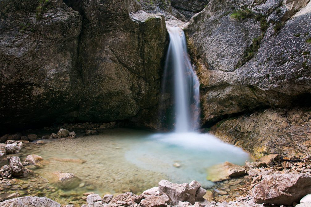 One of the small waterfalls created by the Soca River at its beginnings in the Trenta valley