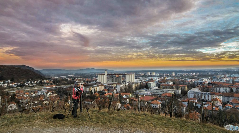 Slovenian landscape photographer Bostjan Kersbaumer with his camera in his hands