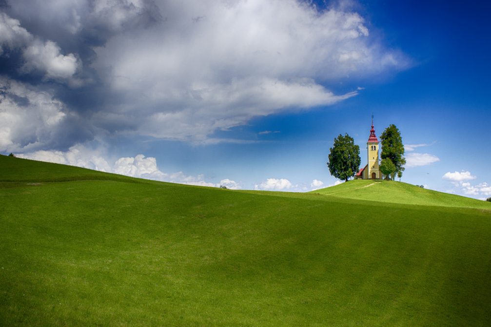 The Church dedicated to Saint Thomas standing on top of a hill in Gorenji Vrsnik, Slovenia