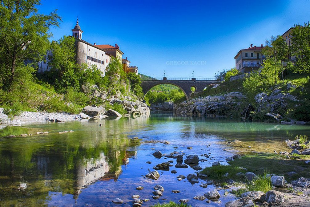 River Soca flowing under the bridge at the town of Kanal Ob Soci, Slovenia