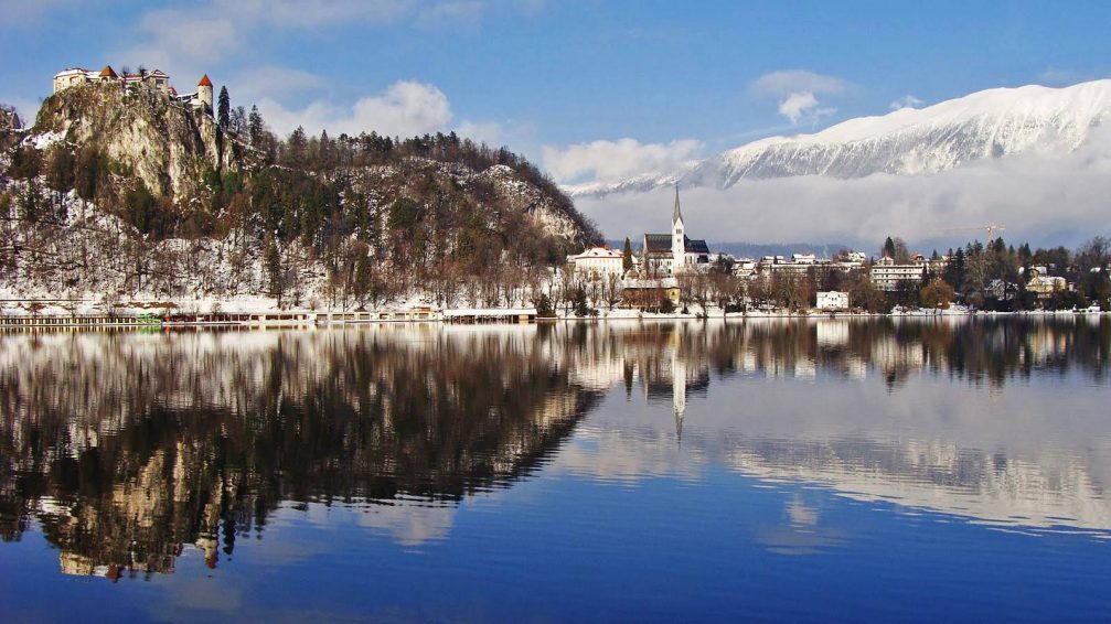 Lake Bled in Slovenia with its cliff top castle and St. Martin's Parish Church under it