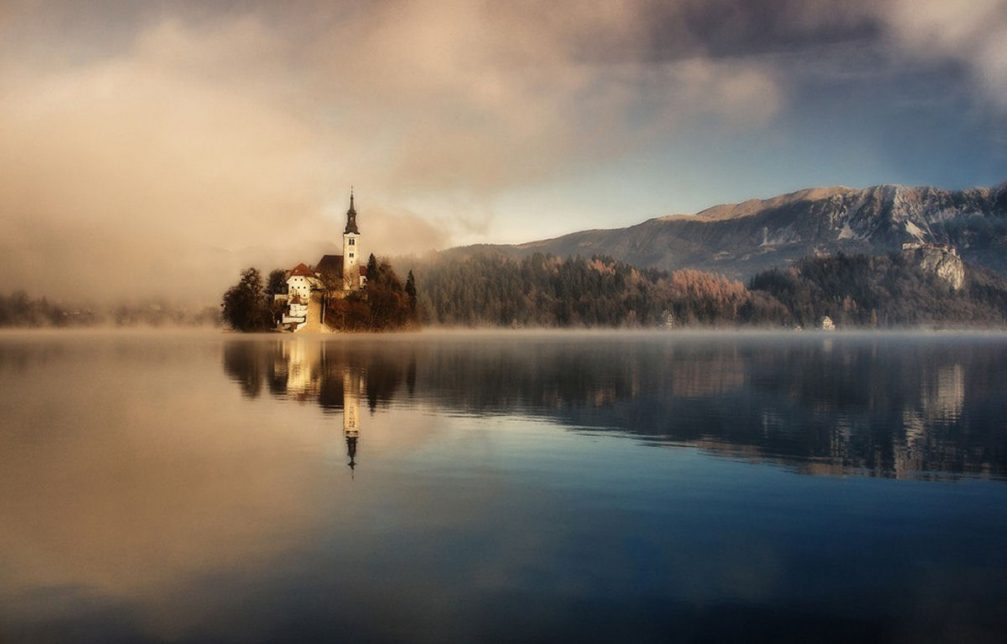 The famous island and church in the middle of Lake Bled in Slovenia in late autumn