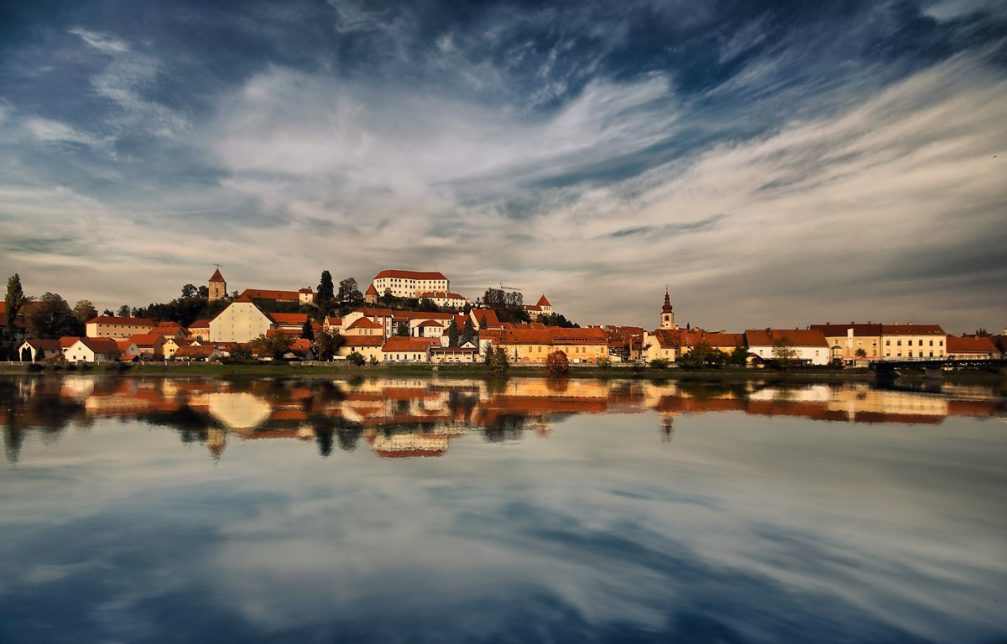 The town of Ptuj stretching out across the Drava River in eastern Slovenia