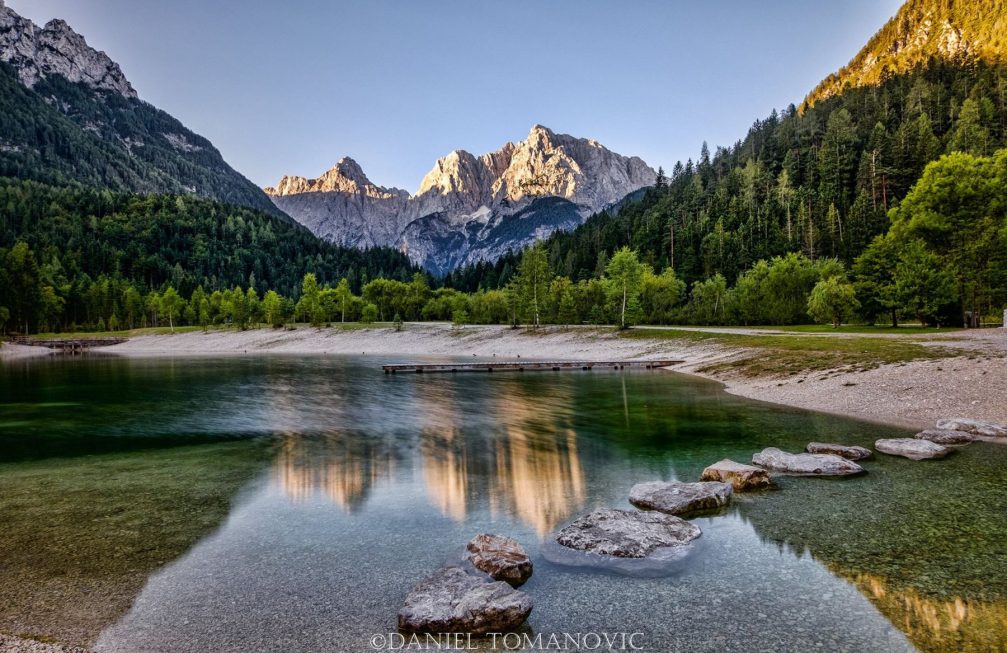 Lake Jasna with stunning reflections of the Slovenian Alps in its calm waters