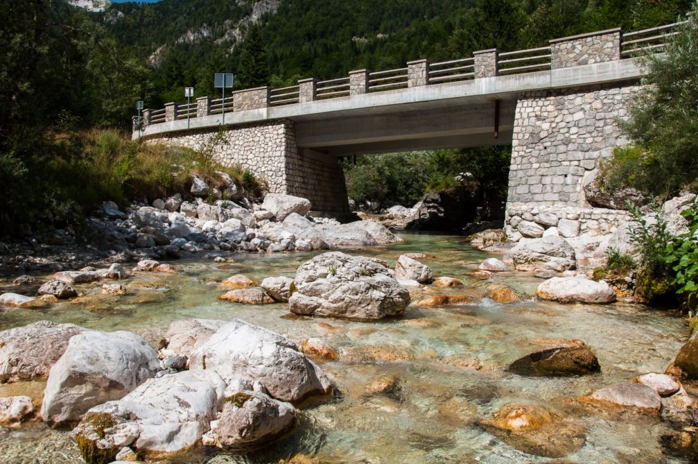 The Soca River flowing under the bridge in the Trenta valley