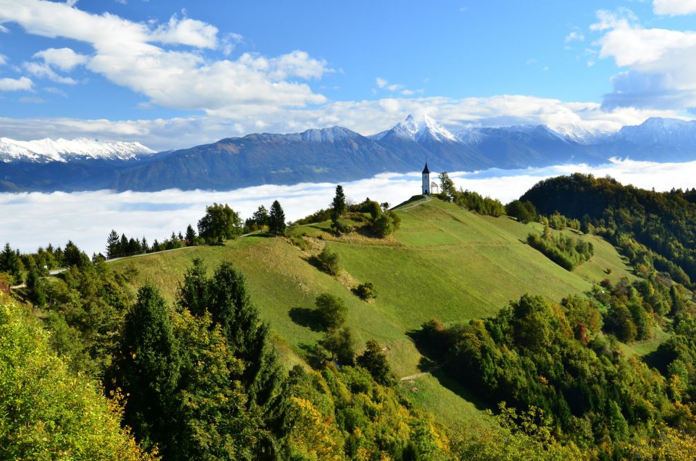 A beautiful panoramic view of the church of saints Primus and Felician in Jamnik, Slovenia