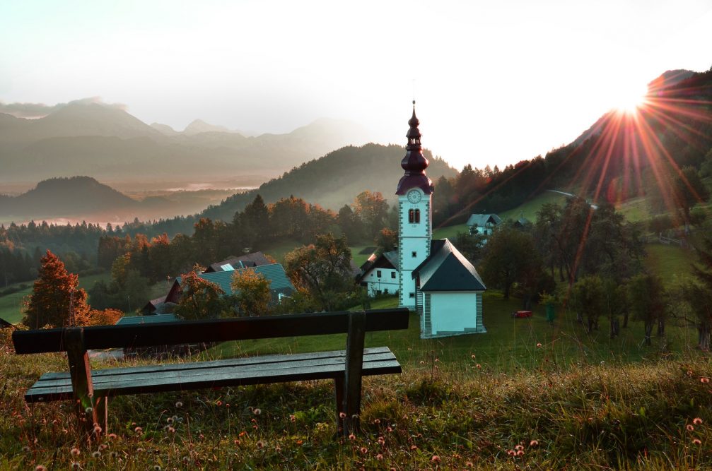 Succursal Church of St. Steven in the village of Kupljenik in northwestern Slovenia at sunrise