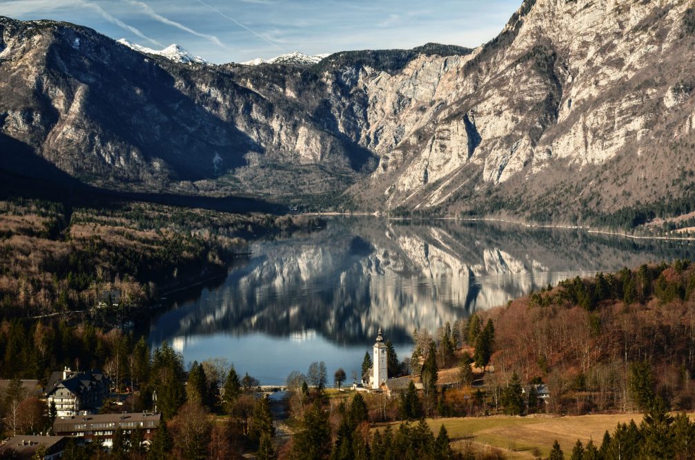 An elevated view of Lake Bohinj, Slovenia from the Vodnikov Razglednik viewpoint in snowless winter time