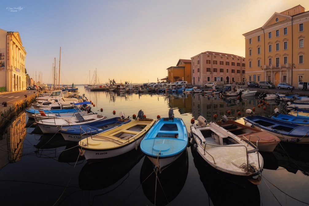 The tiny but very pretty Piran Harbour with numerous small fishing boats and sailboats