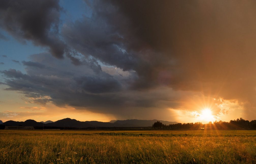 A peaceful sunset over the serene countryside of Predoslje in northwestern Slovenia