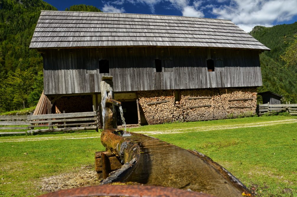 A traditional wooden farm building in the Robanov Kot Valley in Slovenia