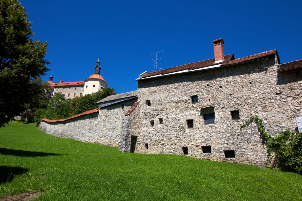 Loka Castle and part of the town wall above the town of Skofja Loka, Slovenia