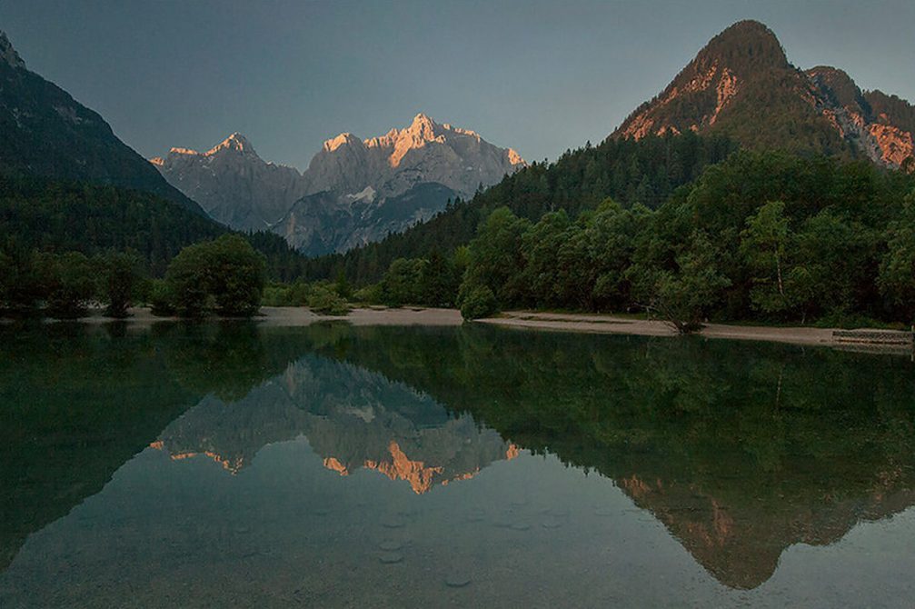 The Jasna Lake near Kranjska Gora with the mountains of the Julian Alps in the background